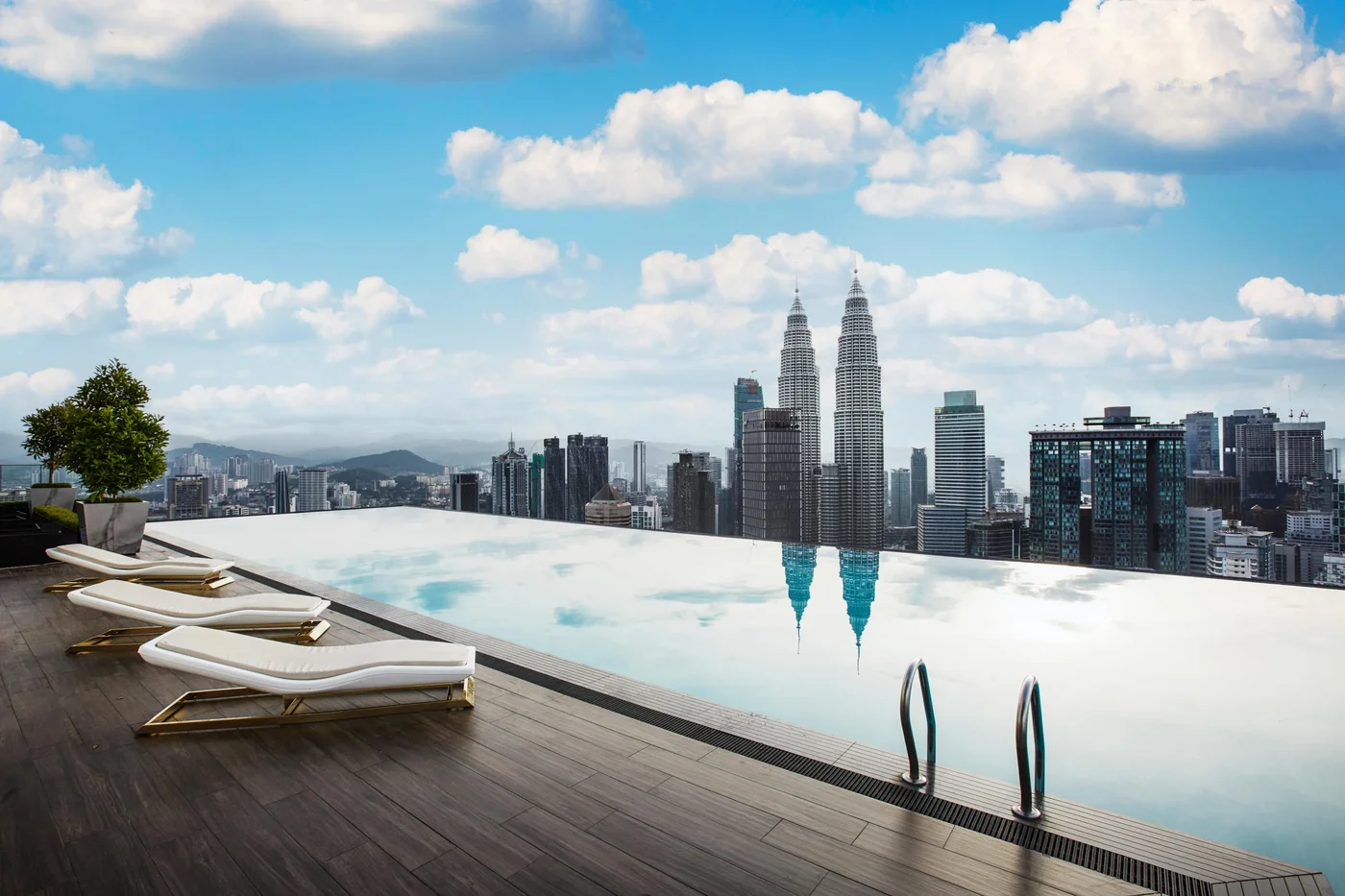 THE FACE Suites rooftop infinity pool with Petronas Twin Towers view, real photo